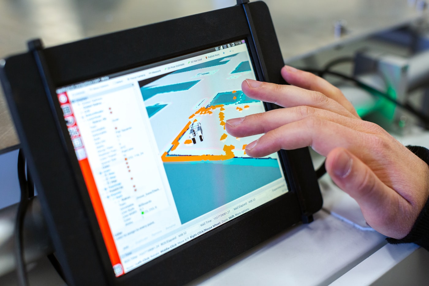 BIM modelling: engineer checking a 3D building services model on a tablet