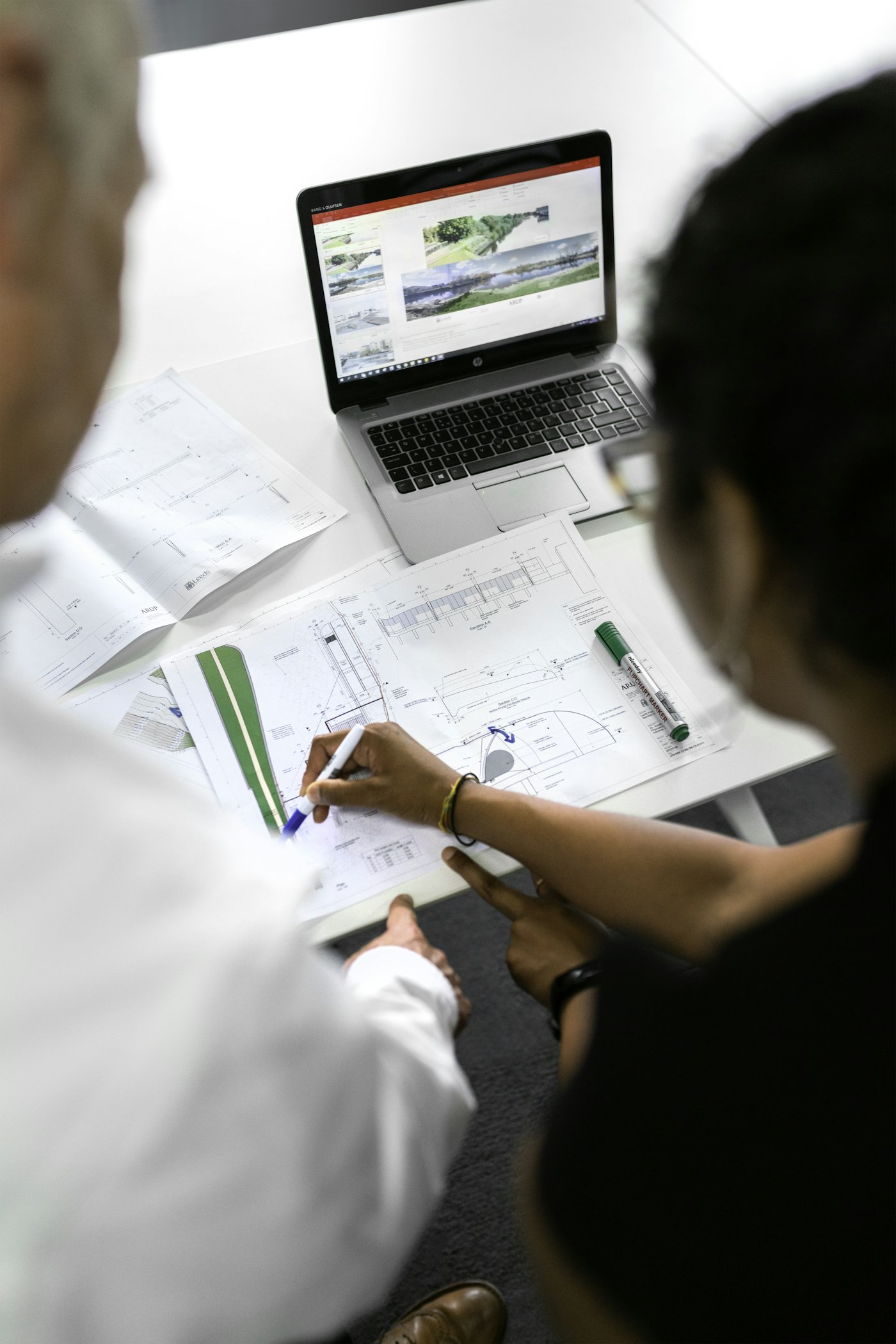 Pipe and duct network calculation: engineer working on technical drawings