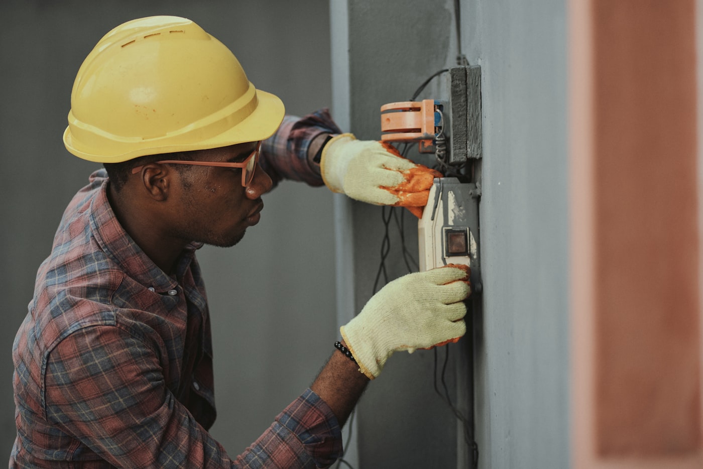 Electrical engineering: electrician installing a distribution board